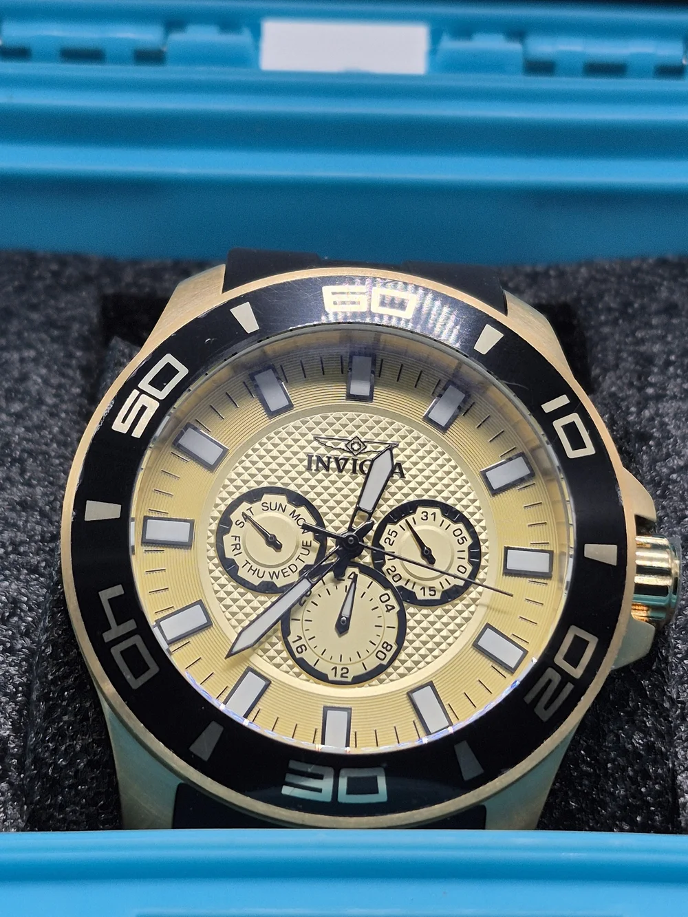 Invicta Gold and Black Chronograph Watch with Turquoise Case